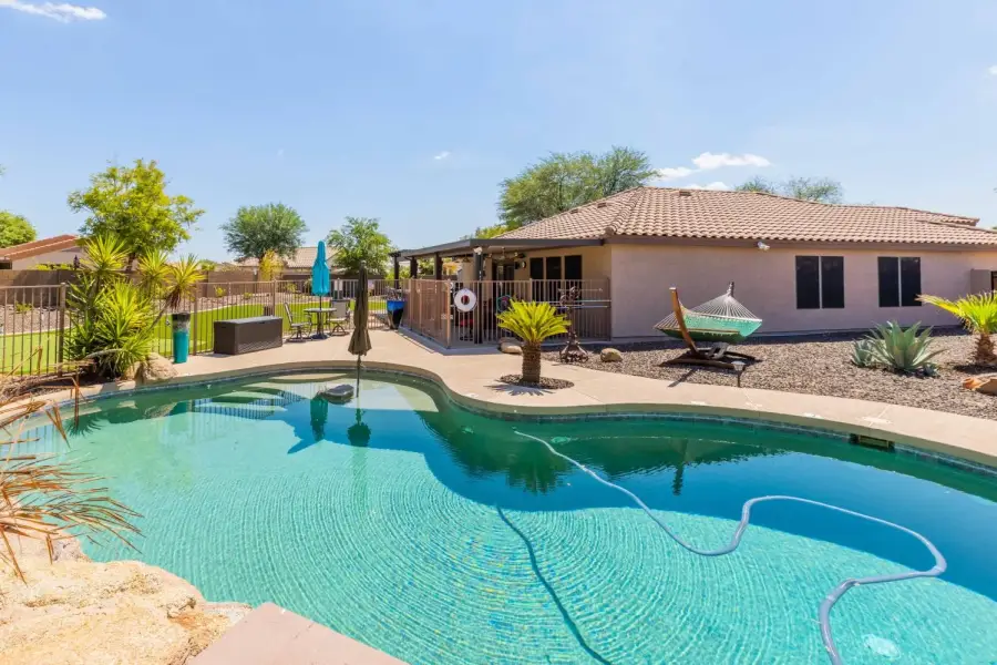 Peaceful back yard with pool & hot tub Peaceful back yard with pool & hot tub